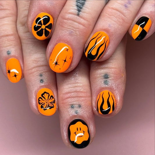 15 Black and Orange Nail Ideas to Try in 2026