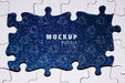 Free Assortment With Puzzle Pieces On Glitter Background Psd