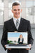 Free Businessman Presenting Laptop Mockup Psd