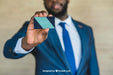 Free Businessman Showing Business Card Psd