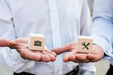 Free Businessmen Holding Dices With Company Ideas Psd
