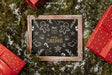 Free Christmas Mockup With Slate And Presents Psd