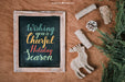 Free Christmas Mockup With Slate Next To Ornaments Psd