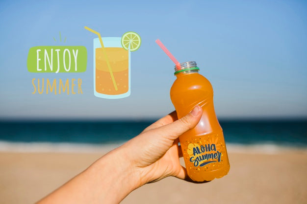 Free Close Up Hand Holding Beverage Bottle With Copy Space Psd