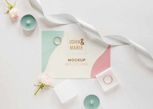 Free Fat Lay Of Wedding Card With Candles And Ribbon Psd