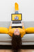 Free Female On Couch Working On Laptop Psd