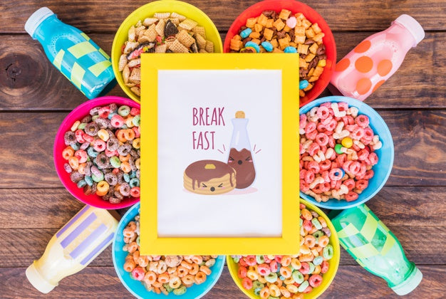 Free Flat Lay Of Frame And Cereal Bowls On Wooden Table Psd