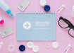 Free Flat Lay Optics Still Life Arrangement With Notepad Mock-Up Psd