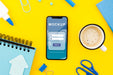 Free Flat Lay Phone Mock-Up With Coffee On Desk Psd