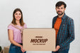 Free Front View Of Couple Holding Moving Box Mock-Up Psd
