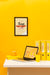 Free Front View Of Desk With Laptop And Frame Psd