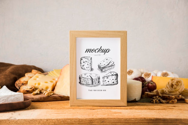 Free Front View Of Frame With Variety Of Cheese And Grapes Psd