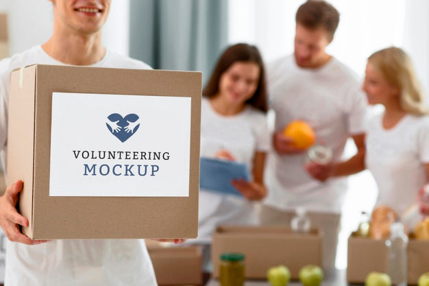 Free Front View Of Male Volunteer Holding Box With Donations Psd