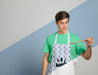 Free Front View Of Man In Apron Holding Wooden Spoon Psd