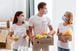 Free Front View Of Volunteers With Medical Masks Preparing Provision Donations Psd