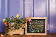 Free Gardening Mockup With Plants And Leaning Slate Psd