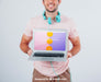 Free Happy Guy Holding Laptop'S Mock Up Psd