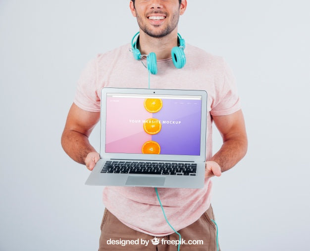 Free Happy Guy Holding Laptop'S Mock Up Psd