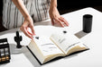 Free High Angle Of Woman Using Book At Desk Psd