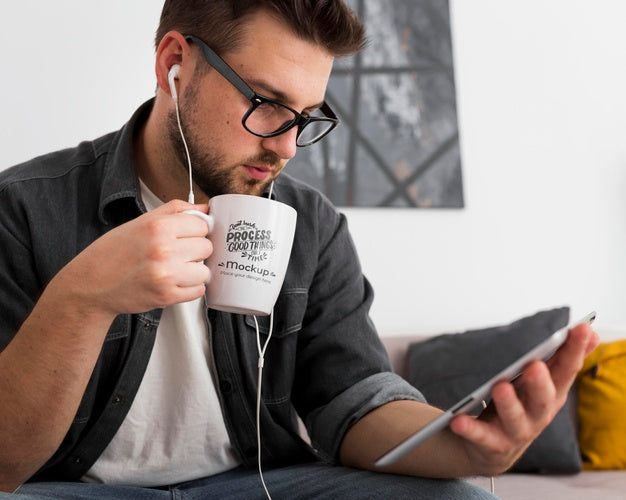 Free Man At Home Drinking From Mug Mock-Up Psd