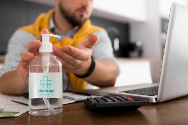 Free Man With Laptop Using Disinfectant Mock-Up Psd
