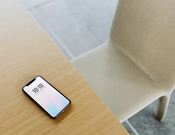 Free Mobile Phone Showing Date And Time On A Wooden Table