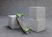 Free Mock-Up Skateboard Upside Down Laying On Cube Psd