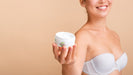 Free Model Holding A Skin Lotion Mock-Up Psd