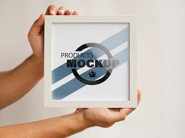 Free Person Holding A Frame Mock-Up Psd
