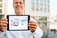 Free Smiley Businessman Outdoors Holding Horizontal Digital Tablet Psd