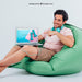 Free Smiley Young Guy Pointing Laptop'S Mock Up Psd
