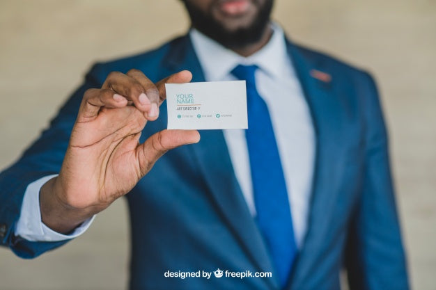 Free Stylish Businessman Showing Business Card Psd