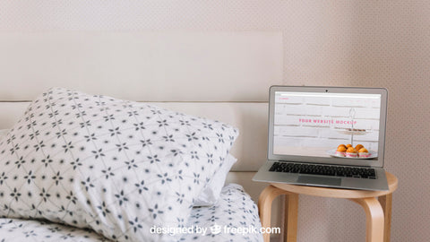 Free Technology Mockup With Laptop Next To Bed Psd