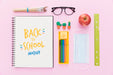 Free Top View Of Back To School Notebook With Apple And Glasses Psd