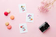 Free Top View Of Card With Flowers And Camera Psd