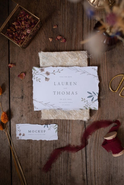 Free Top View Of Paper Mock-Up Rustic Wedding Invitation With Leaves And Flowers Psd