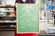 Free Waitress Presenting Board With Menu Psd