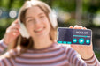Free Woman Holding Phone With Music App Mock-Up Psd